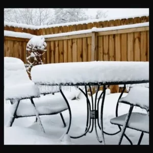 Snow covered outdoor furniture